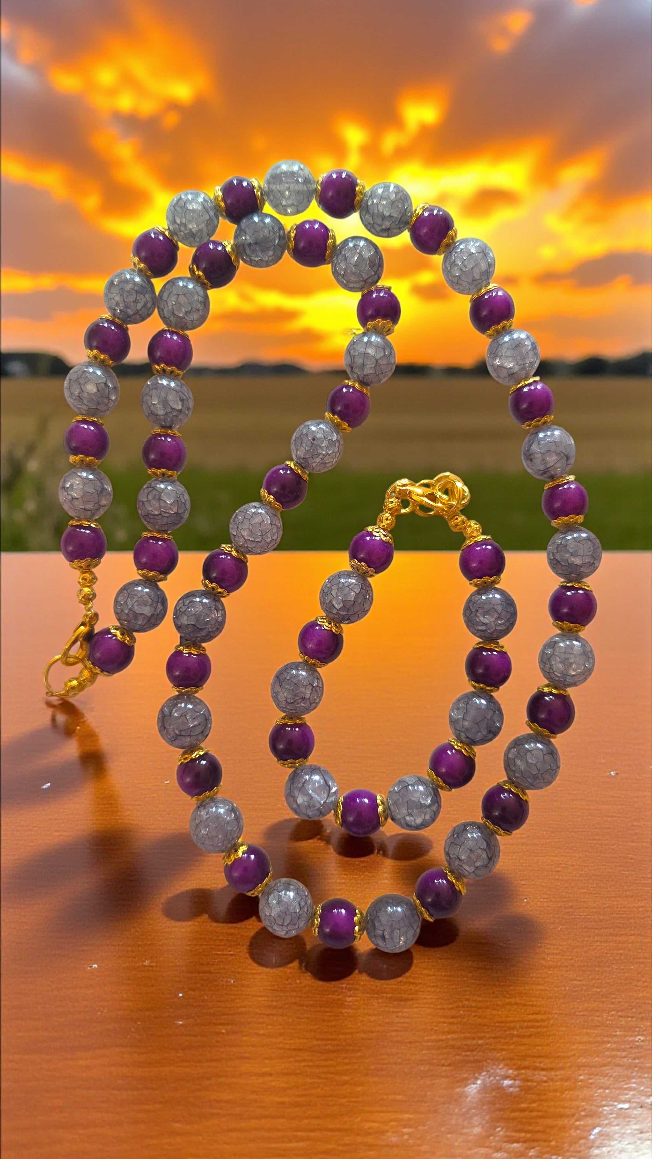 Plum and gray beaded jewelry set with necklace and matching bracelet featuring gold tone clasps