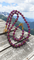 Plum and black beaded necklace and bracelet set with gold tone accents