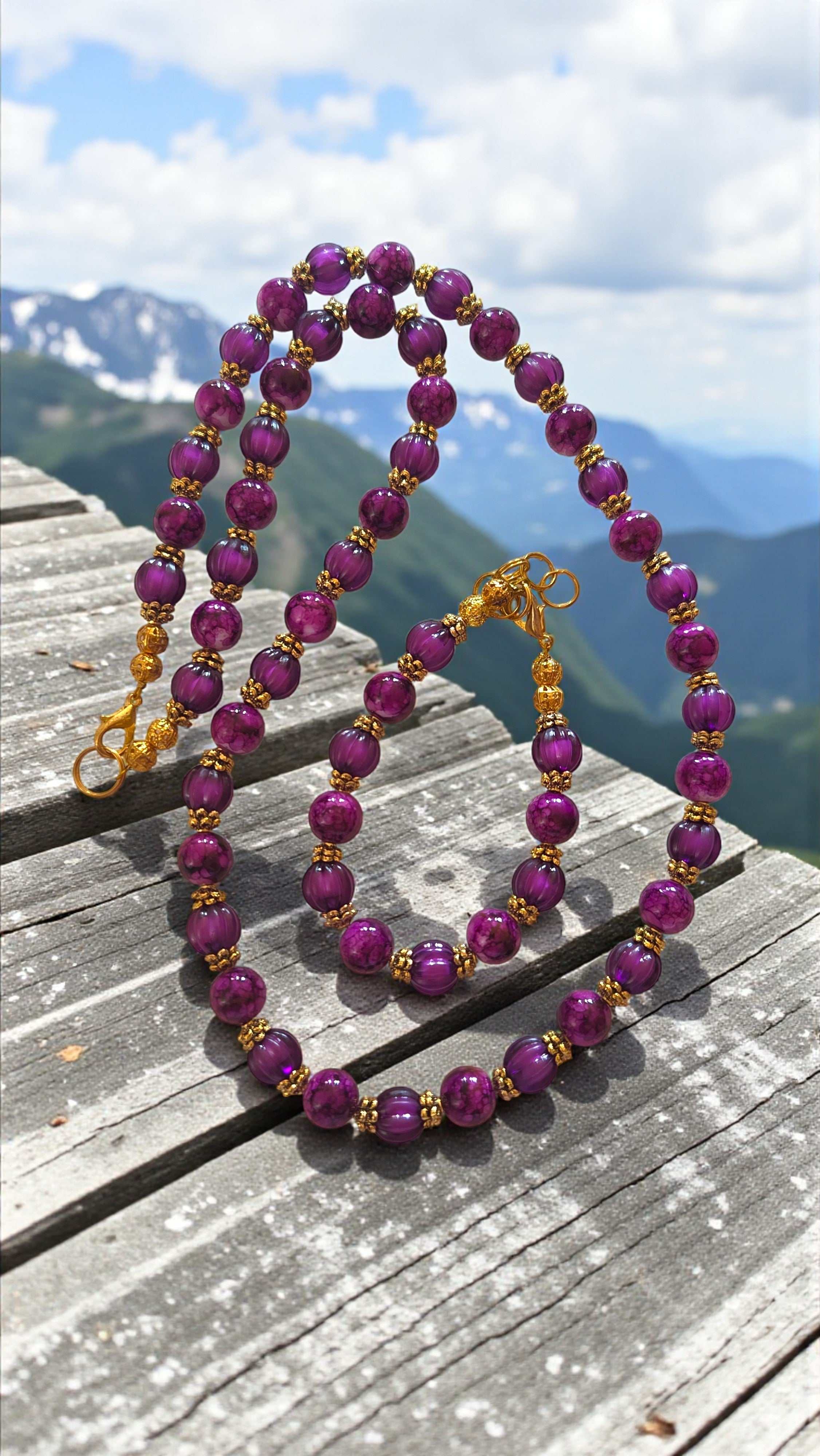 Plum and black beaded necklace and bracelet set with gold tone accents
