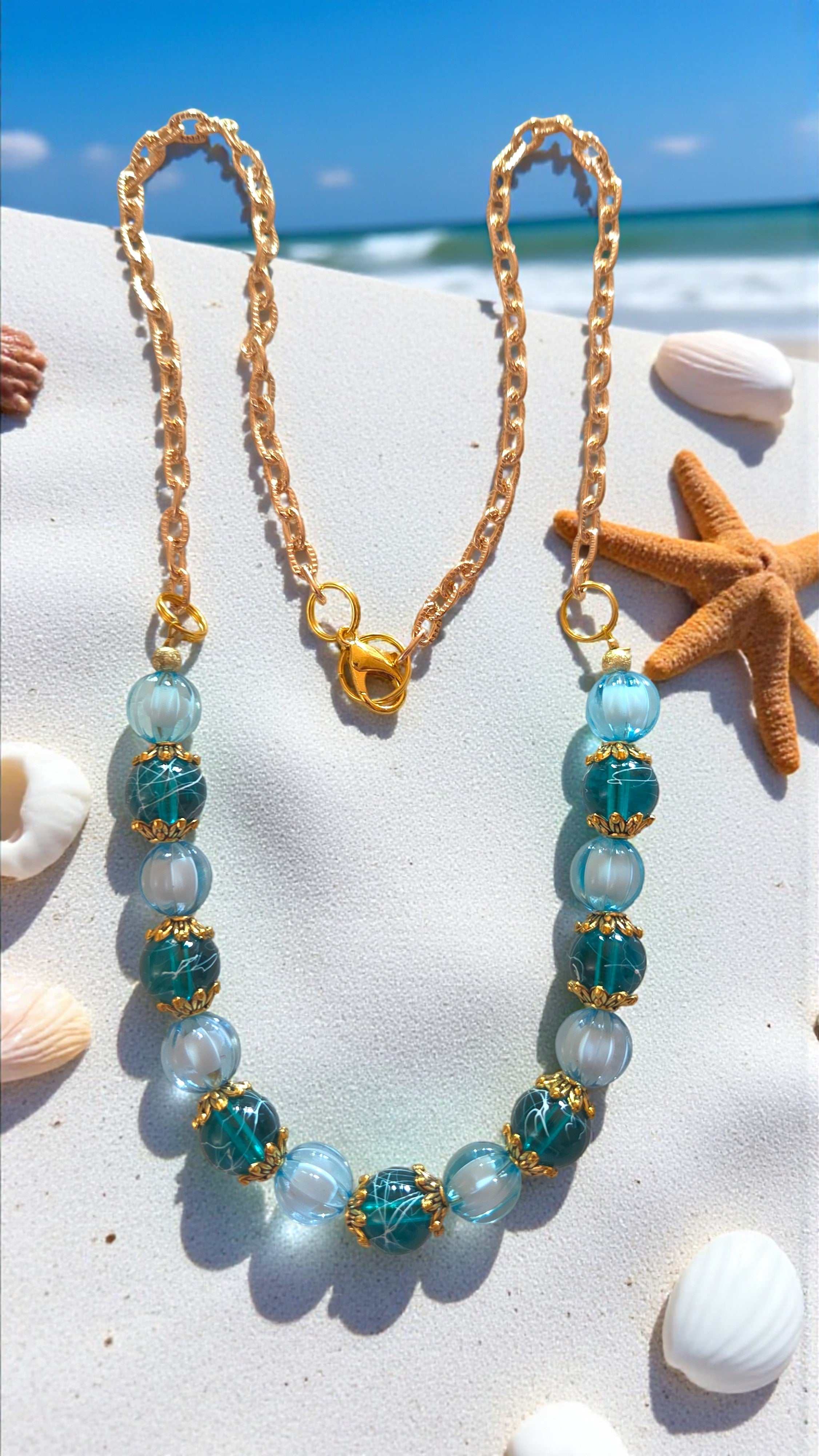 Turquoise bead necklace with acrylic watermelon beads, glass beads, gold tone bead caps, and gold tone chain