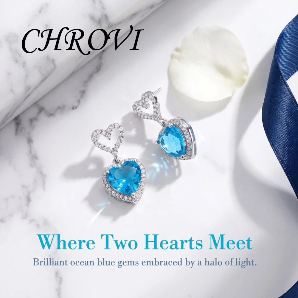 Exquisite 925 sterling silver ear jewelry. Long fringed heart-shaped earrings with tiny inlaid zirconia hearts. Women's style.