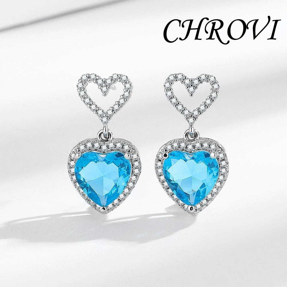 Exquisite 925 sterling silver ear jewelry. Long fringed heart-shaped earrings with tiny inlaid zirconia hearts. Women's style.