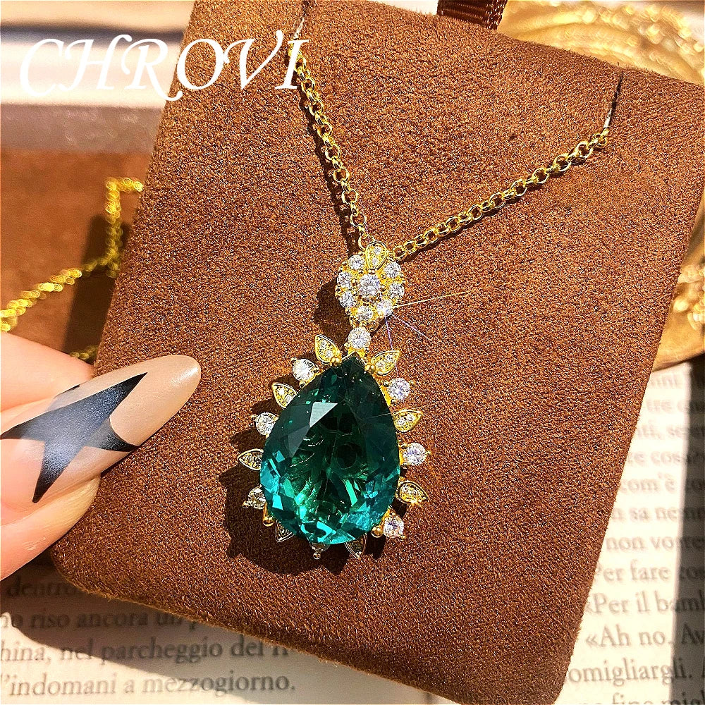 Fashionable and exquisite golden luxury gemstone drop-shaped pendant necklace, women's set including ring, earrings and pendant.