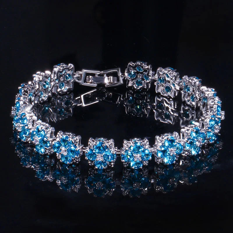 ThreeGraces Luxury Shiny Blue Zirconia Flower Tennis Bracelet for Women Fashion Bridal Wedding Evening Party Jewelry BR402