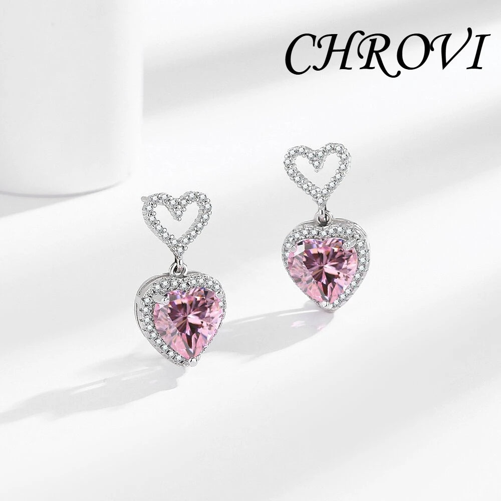 Exquisite 925 sterling silver ear jewelry. Long fringed heart-shaped earrings with tiny inlaid zirconia hearts. Women's style.