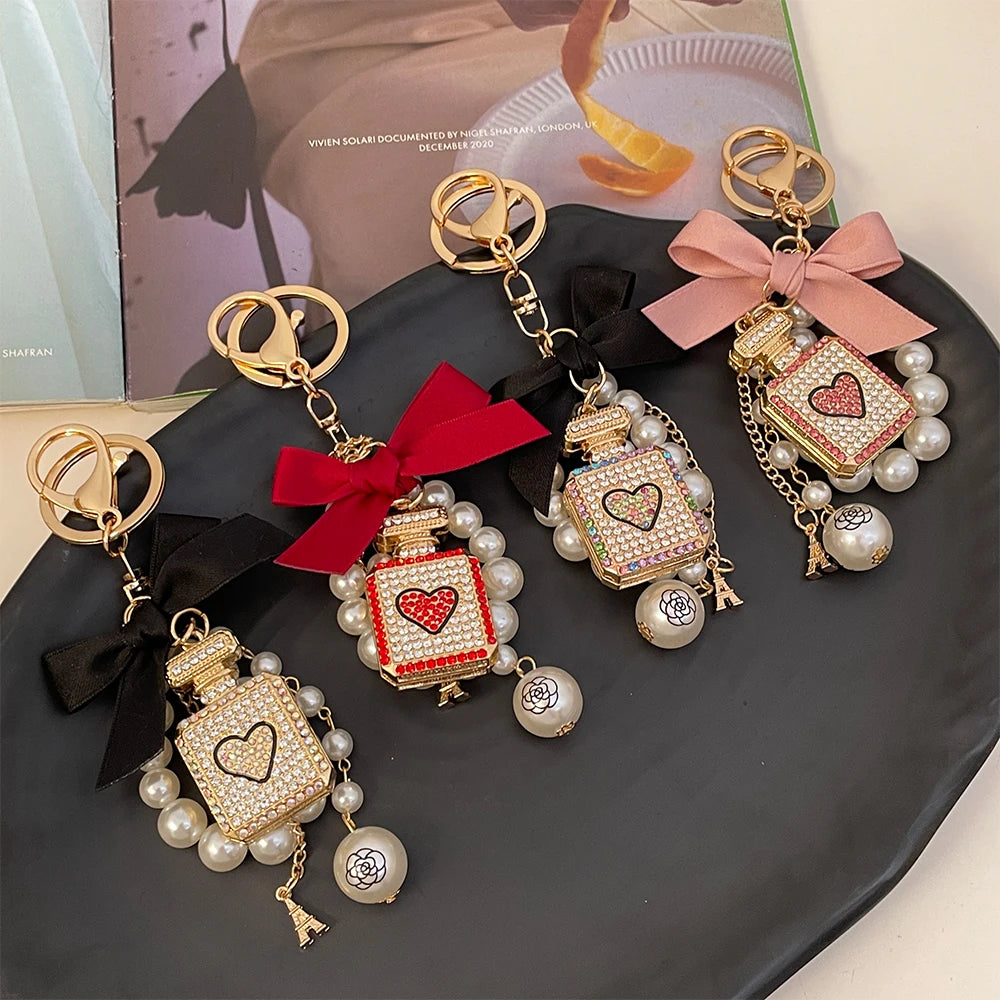 2024 New Luxury Crystal Love Perfume Bottle Keychain Pearl Bow Key Ring Eiffel Tower Women's Bag Pendant Souvenir Gift