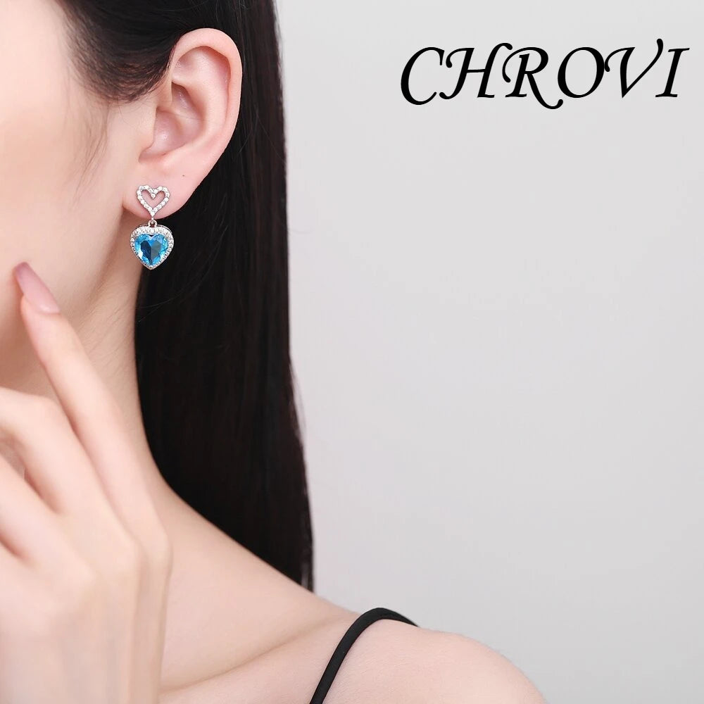 Exquisite 925 sterling silver ear jewelry. Long fringed heart-shaped earrings with tiny inlaid zirconia hearts. Women's style.