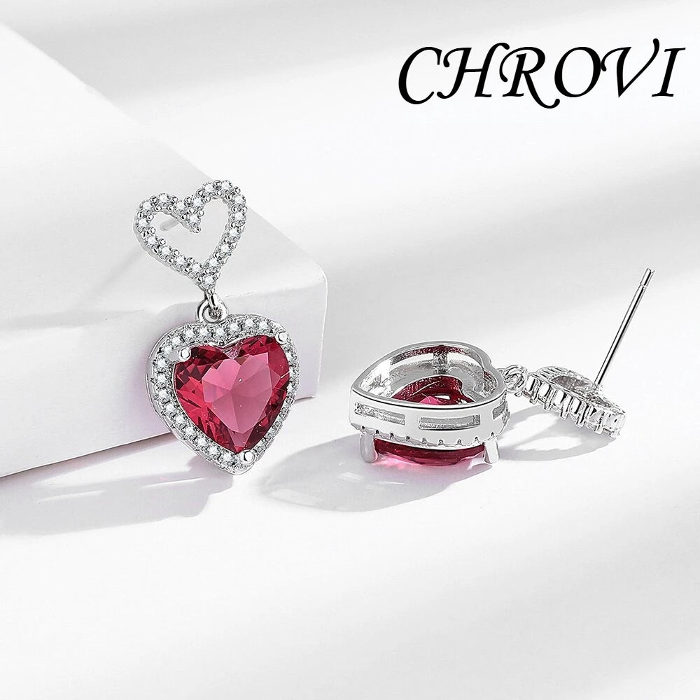 Exquisite 925 sterling silver ear jewelry. Long fringed heart-shaped earrings with tiny inlaid zirconia hearts. Women's style.