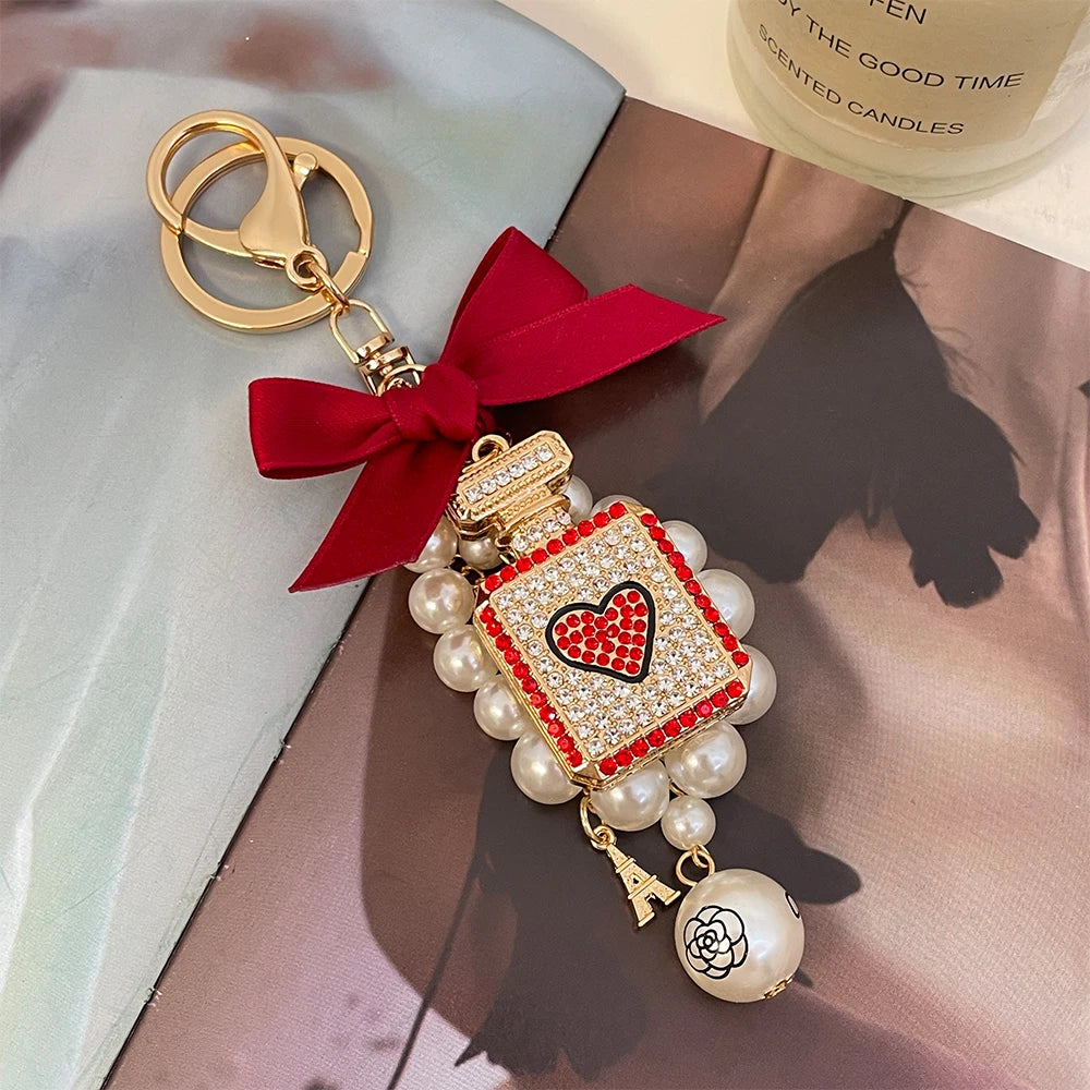 2024 New Luxury Crystal Love Perfume Bottle Keychain Pearl Bow Key Ring Eiffel Tower Women's Bag Pendant Souvenir Gift