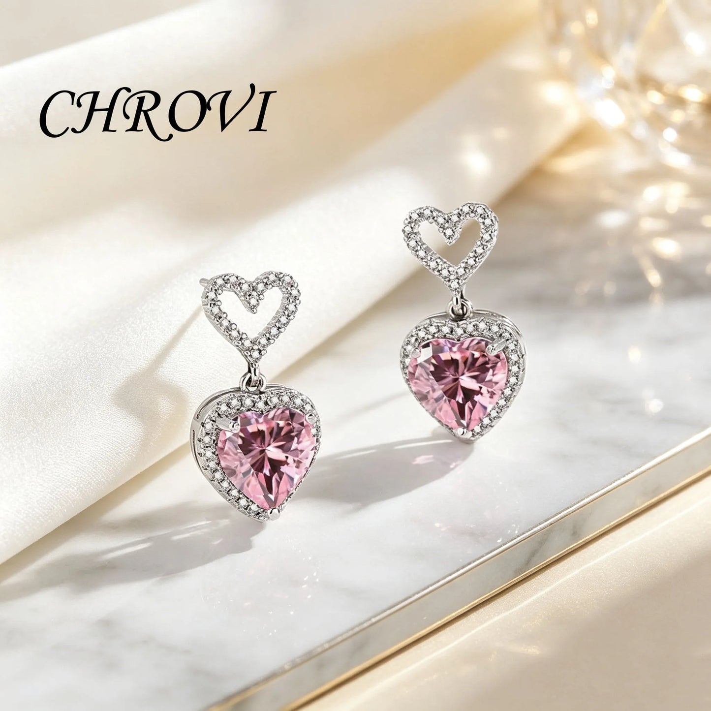 Exquisite 925 sterling silver ear jewelry. Long fringed heart-shaped earrings with tiny inlaid zirconia hearts. Women's style.