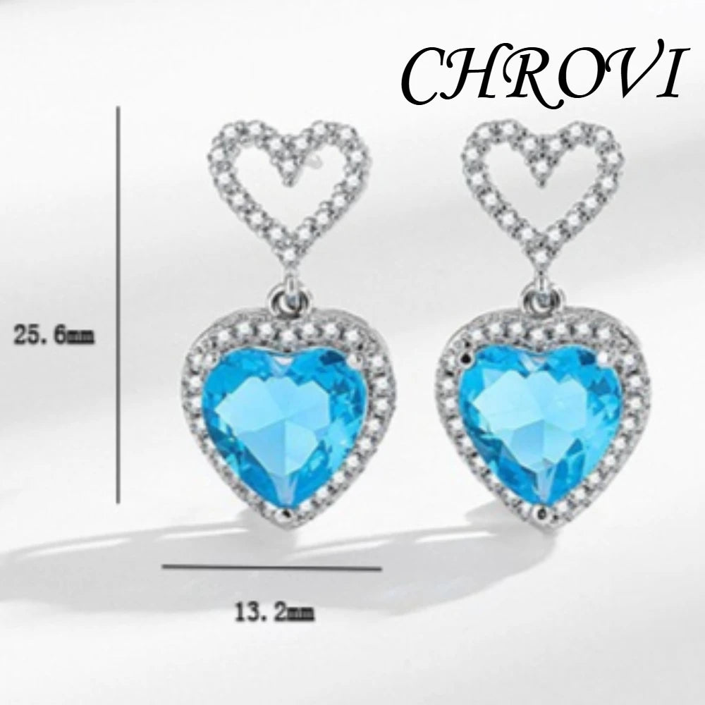 Exquisite 925 sterling silver ear jewelry. Long fringed heart-shaped earrings with tiny inlaid zirconia hearts. Women's style.