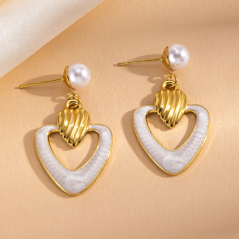 ANENJERY 316L Stainless Steel Hollow Heart Imitation Pearls Stud Earrings For Women Luxury Niche Temperament Simple Jewelry Gift